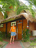 Patti standing in front of our cottage